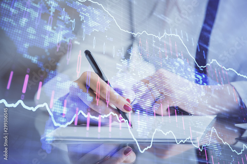 Wallpaper Mural Double exposure of hands making notes with forex chart huds. Stock market concept. Torontodigital.ca