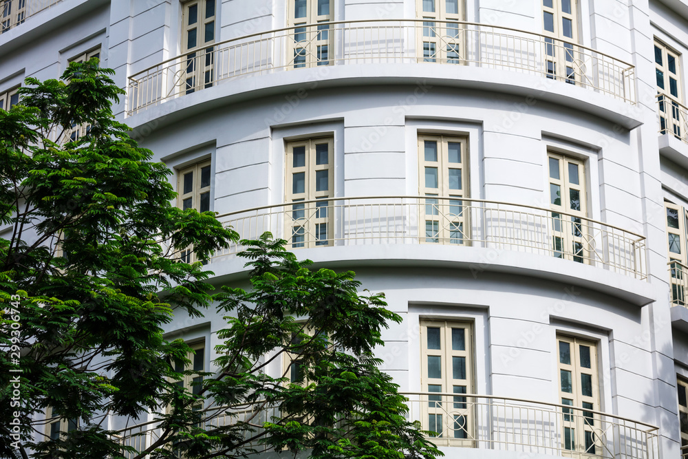 building with balconies and a tree