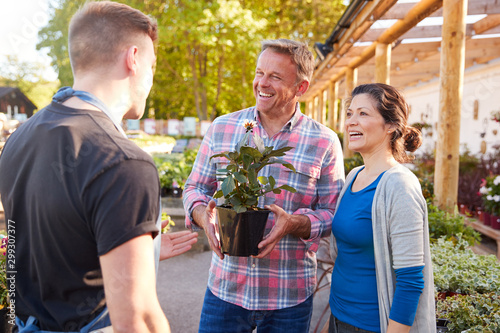 Photography Mature Couple Buying Plants From Male Sales Assistant In Garden Center
