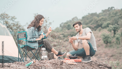 Couple hiker in the mountains, group of friends hiking climbing mountain nature landscape. lifestyle man journey and team adventure giving help or support. winner team for success together.