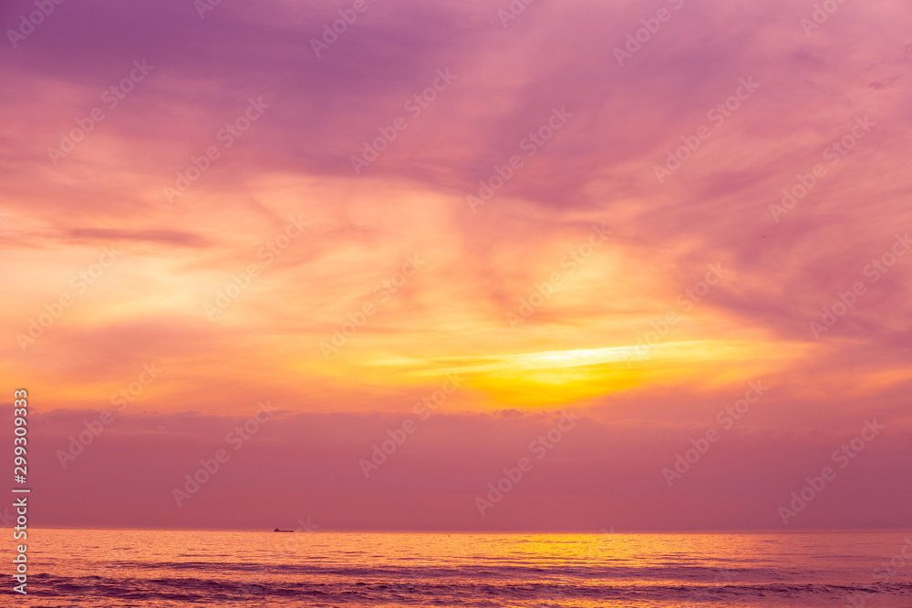 Sunset over the sea. Atlantic ocean in the evening. Beautiful sunset with dramatic sky