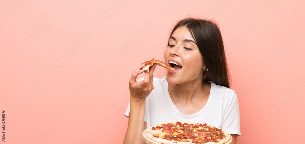 Young woman with a pizza in a table Young woman with a pizza in a table