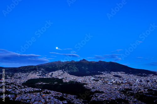 Full moon over the city of Quito at sunrise.
