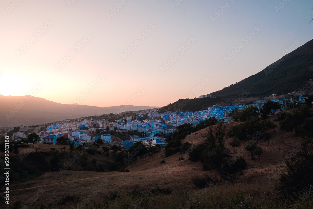 Φωτογραφία Panorama of the city of Chefchaouen at sunset, also called  the blue city, in Morocco