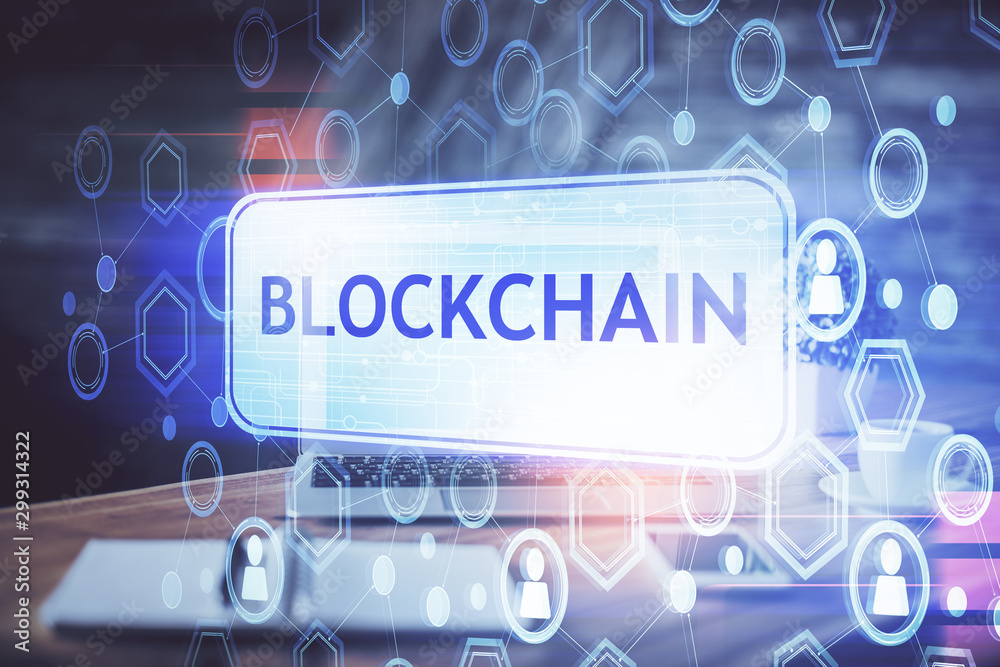 Multi exposure of blockchain theme hologram and table with computer background. Concept of bitcoin crypto currency. Multi exposure of blockchain theme hologram and table with computer background. Concept of bitcoin crypto currency.