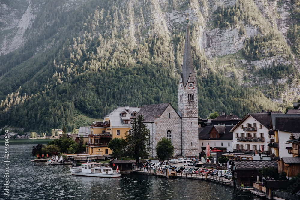 Hallstadt, Austria - July 2019: View of Hallstatt village and lake Hallstater See In Alps.