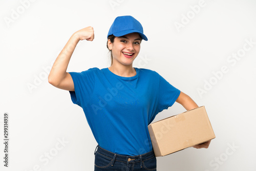 Young delivery girl over isolated white background celebrating a victory