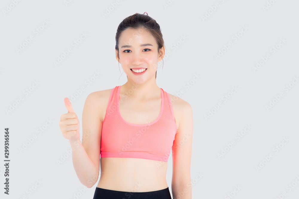 Beautiful portrait young asian woman in sport clothes with satisfied and confident gesture thumbs up isolated on white background, asia girl have shape and wellness, exercise for fit with health. Beautiful portrait young asian woman in sport clothes with satisfied and confident gesture thumbs up isolated on white background, asia girl have shape and wellness, exercise for fit with health.