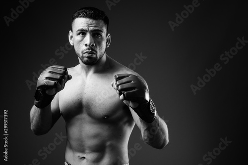 Portrait of young muscular Hispanic man as boxer shirtless © Ranta Images