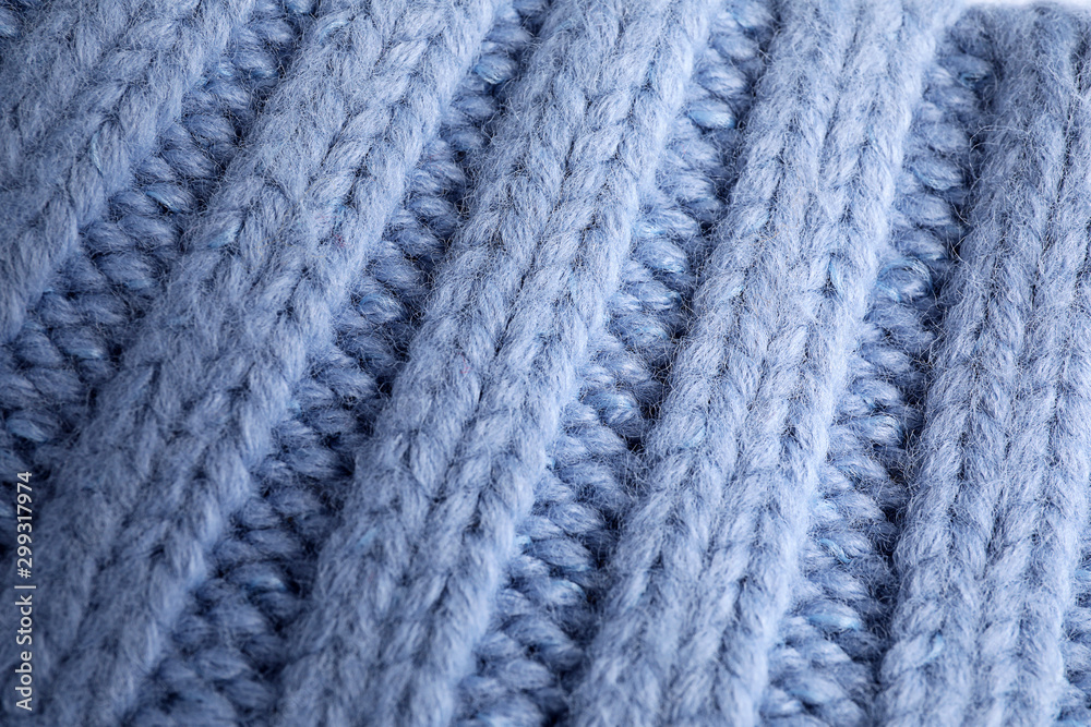 Blue knitted sweater as background, closeup view Blue knitted sweater as background, closeup view