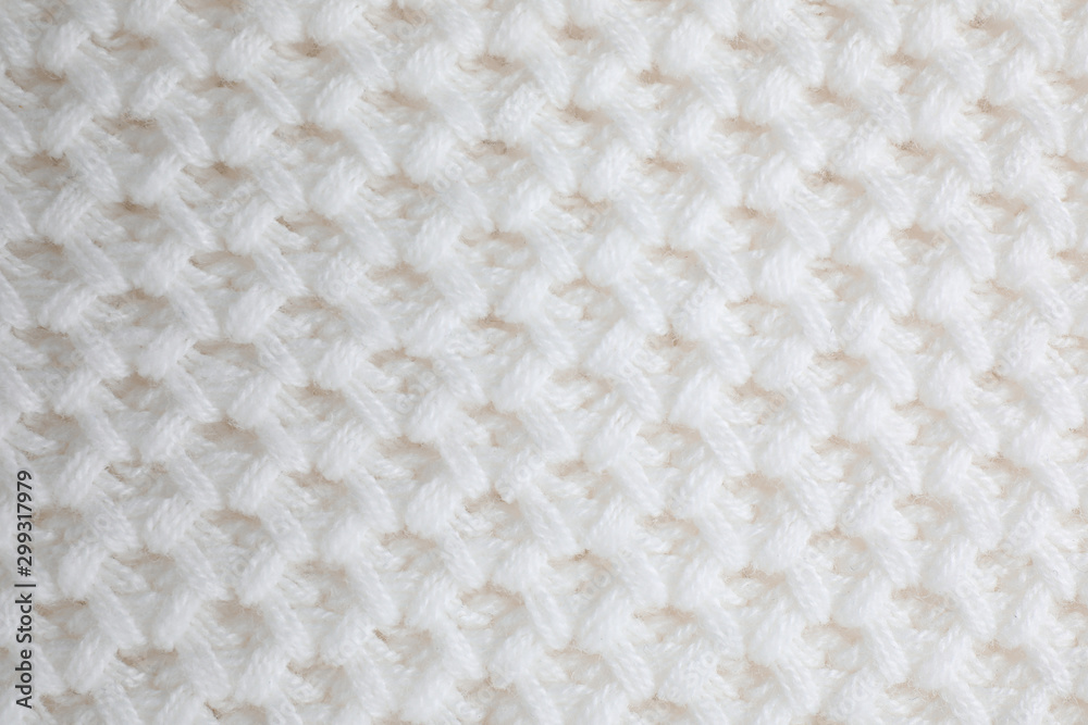 White knitted sweater as background, closeup view White knitted sweater as background, closeup view