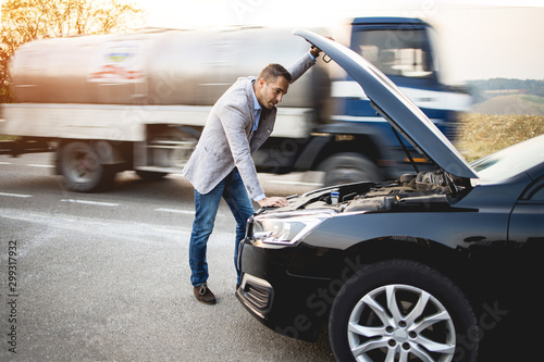 Bussines man need help for demaged car.Stock photo photo