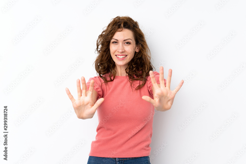 Fototapeta premium Young pretty woman over isolated background counting ten with fingers