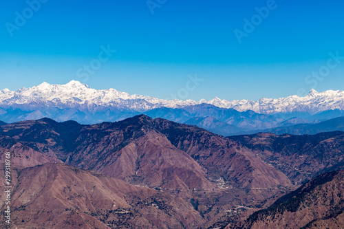 huge mountains snowy mountain peaks of the Garhwal Himalayas namely Banderpooch, Swargrohini, Gangotri Group, Yamunotri and Nanda Devi are clearly visible from here. photo