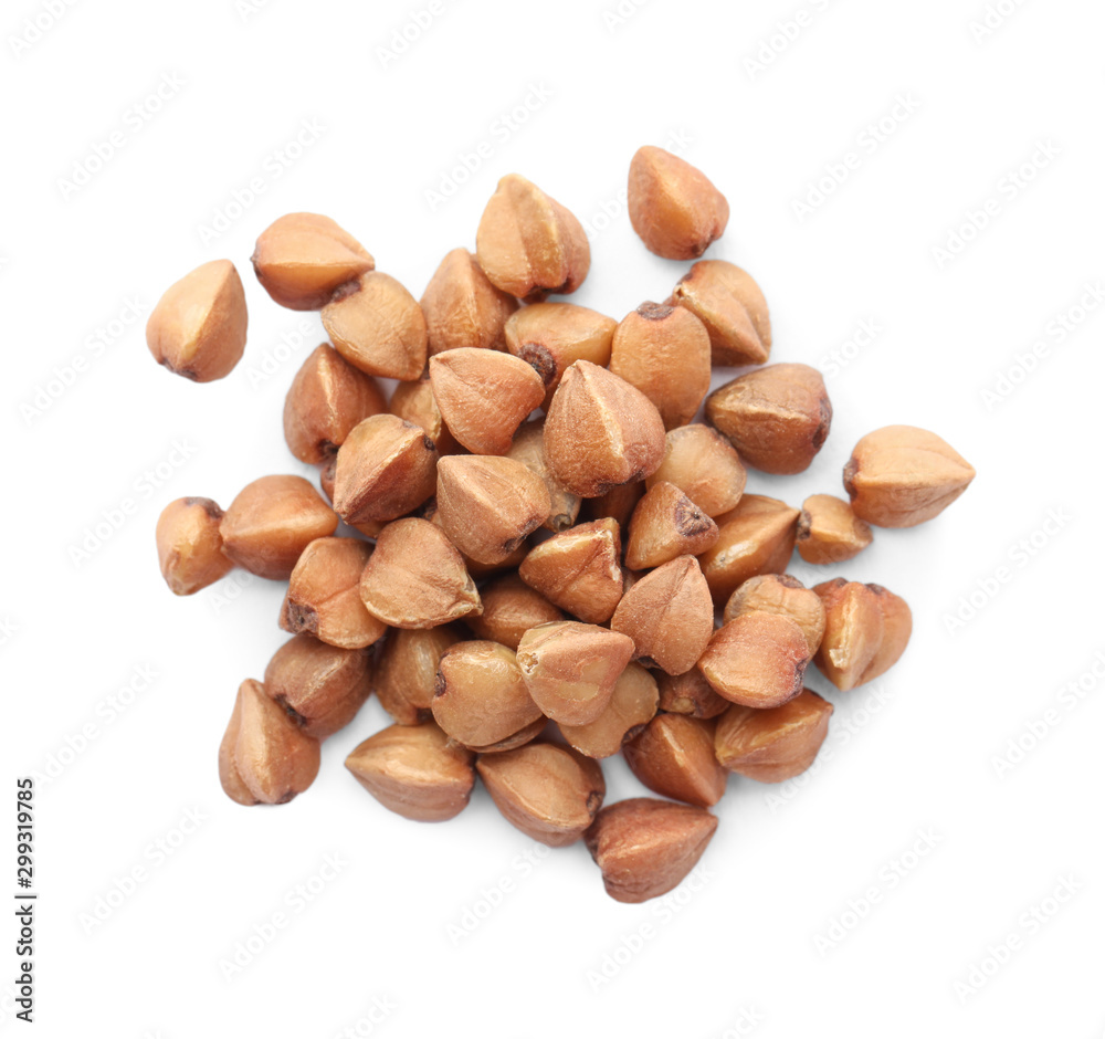 Pile of buckwheat grains isolated on white, top view. Organic cereal Pile of buckwheat grains isolated on white, top view. Organic cereal