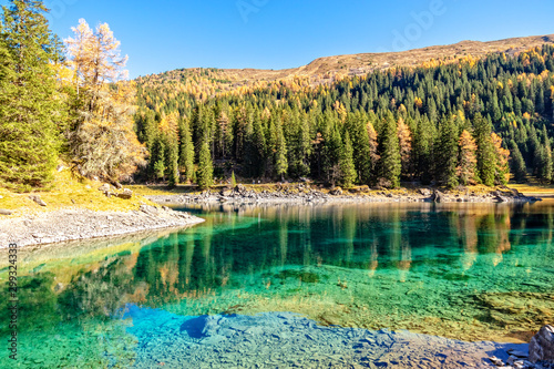 Sunny Day At Mountain Lake At Autumn Alps. Lake Obernberg is a mountain lake located in the Stubai Alps in Tyrol, Austria.