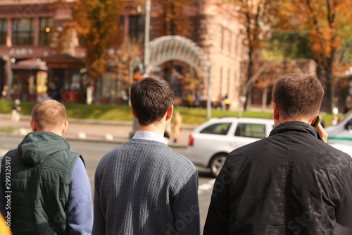 People in a megalopolis cross the road