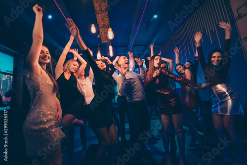Having fun on disco party concept. Youth people wearing formalwear dress meeting celebrate event feel crazy rejoice dance moving on discotheque raise fists scream shout