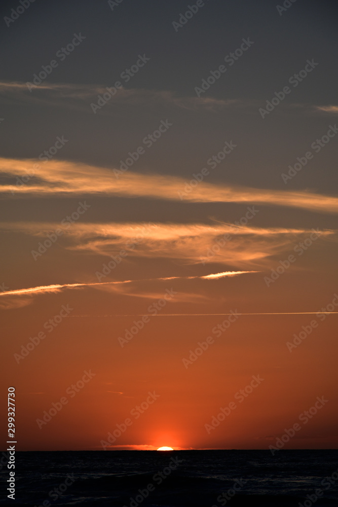 orange sunset on the beach of the Baltic Sea in Poland