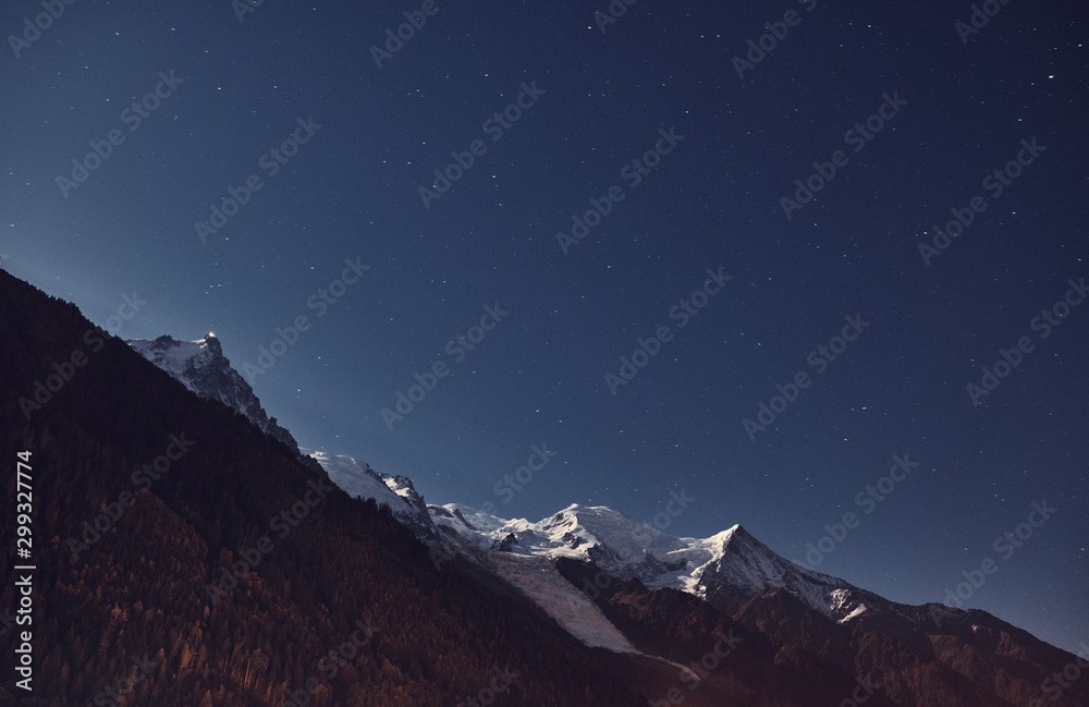 View from Chamonix to the Mont Blanc massif at night. Alps, France. Mountain landscape. View from Chamonix to the Mont Blanc massif at night. Alps, France. Mountain landscape.