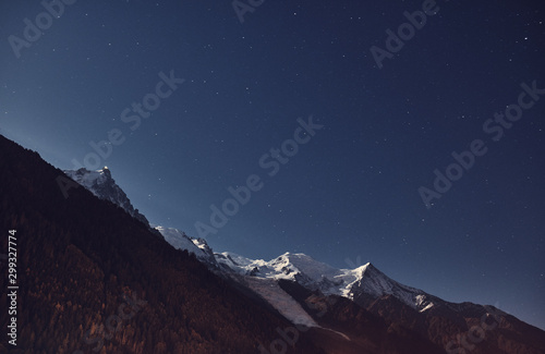 View from Chamonix to the Mont Blanc massif at night. Alps, France. Mountain landscape.
