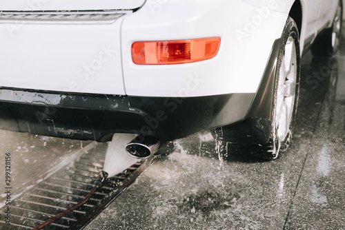 Male hands cleans car interior on carwash station