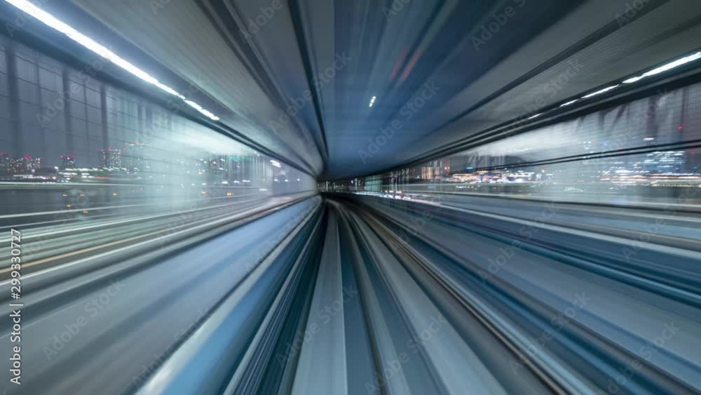 Japan Tokyo train moving through the city timelapse at night