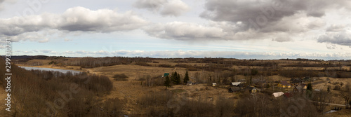 Panorama of spring landscape with hills and forests. Izborsk, Pskov region, Russia.