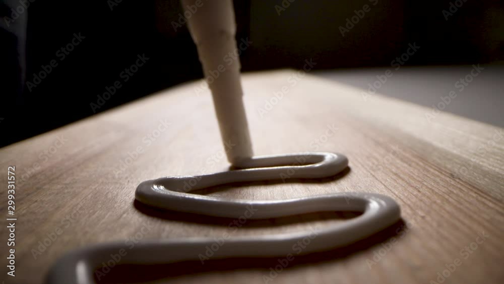 wood adhesive - putting glue on a piece of wooden board