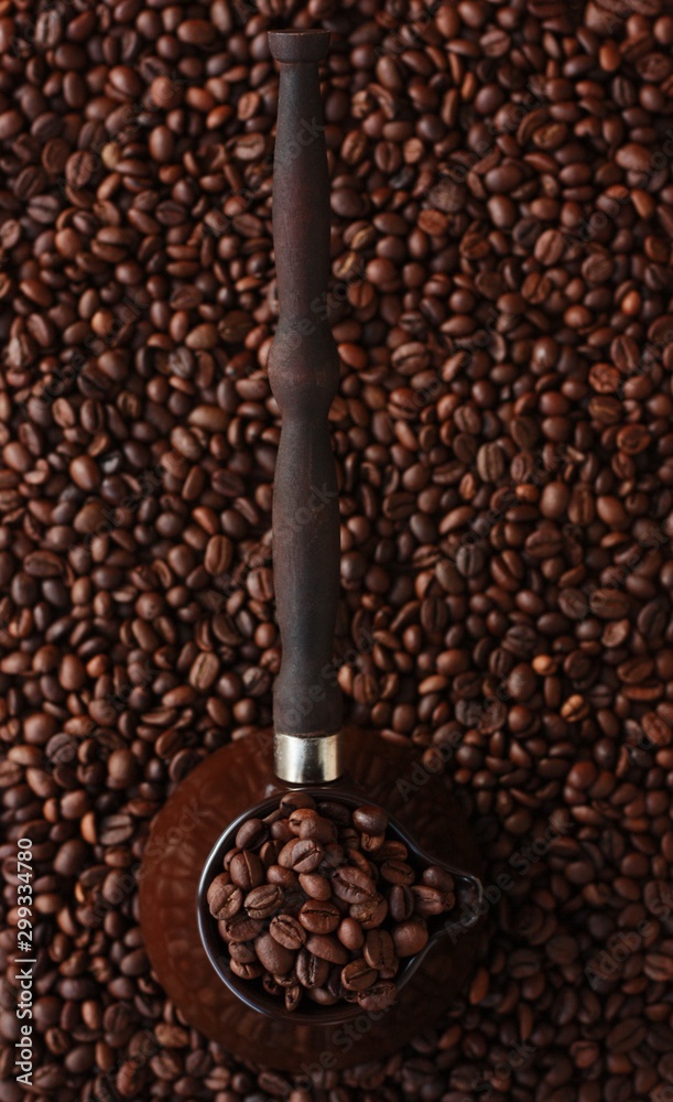 Fototapeta premium Roasted coffee beans in Turka on the table