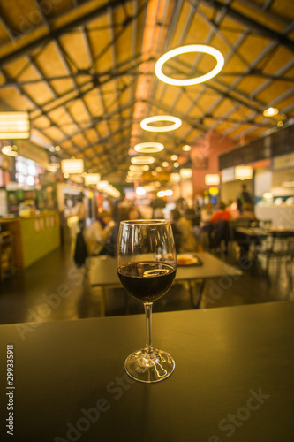 wine glass on a table in a food market along the riverside in Porto Portugal  photo