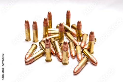 A group of .22 caliber full metal jacket bullets on a white background photo