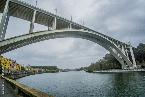 Ponte da Arrábida a landmark arch bridge over the Douro river In Porto , Portugal very close to where its connecting to the Atlantic ocean. 