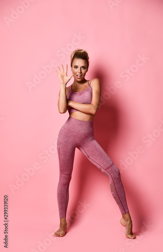 Sports girl on a pink background