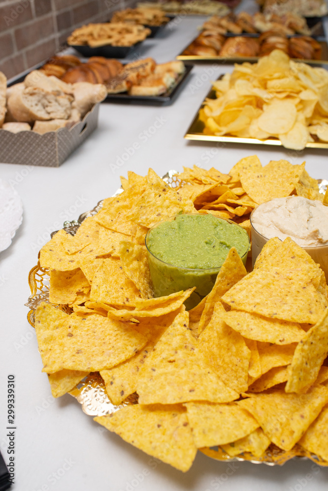 Table of appetizers with mexican nachos Table of appetizers with mexican nachos