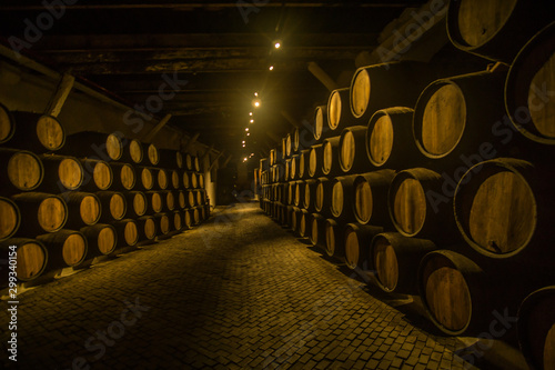 Barrels of wine in the wine cellar one of the famous wineries in Porto in Portugal  which is making an amazing wine and port wine.