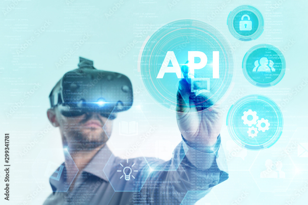 Business, Technology, Internet and network concept. Young businessman working on a virtual screen of the future and sees the inscription: Business, Technology, Internet and network concept. Young businessman working on a virtual screen of the future and sees the inscription: