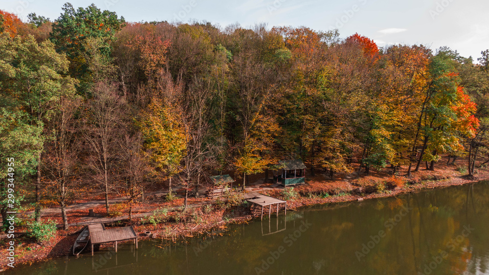 Aerial top view. Autumn landscape. Lake in autumn forest Aerial top view. Autumn landscape. Lake in autumn forest