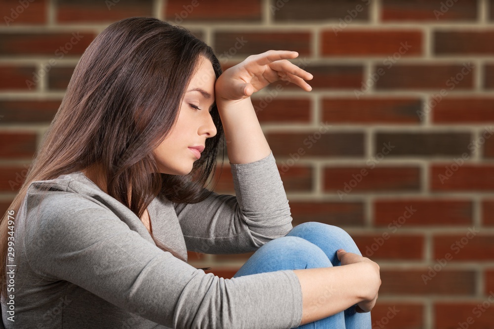 Young woman crying on background Young woman crying on background
