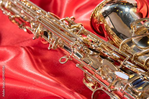 Photography Beautiful macro photo of the details of a wind instrument of a golden alto saxop