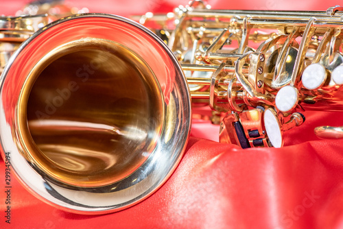 Sticker Beautiful macro photo of the details of a wind instrument of a golden alto saxop