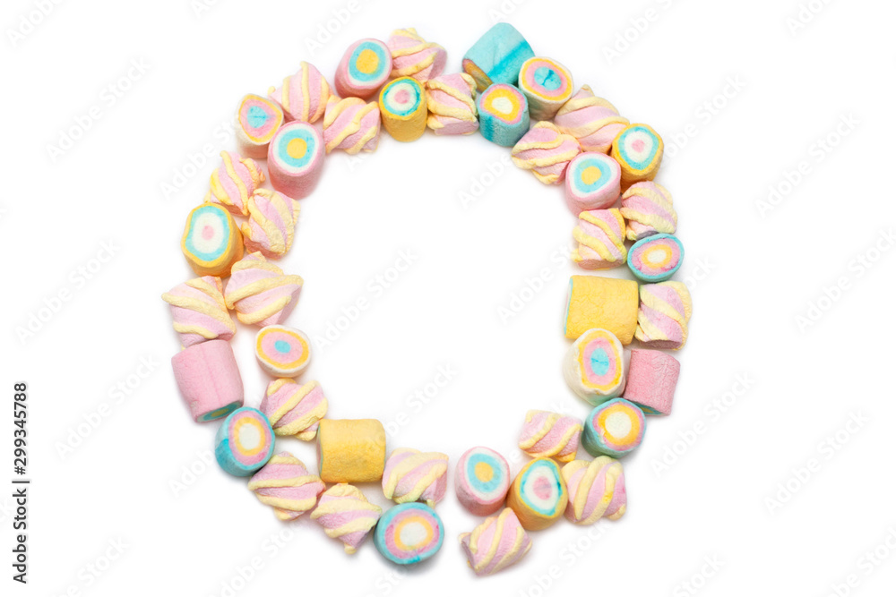 Frame of multi-colored sweets on a white background, isolate. Holiday Marshmallows Frame of multi-colored sweets on a white background, isolate. Holiday Marshmallows