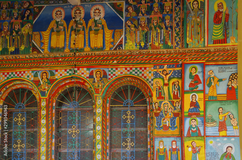 Exterior paintings. Christian murals on the walls. Illustrations of New Testament. Enda Iyesus Church. Ethiopia, Tigray Region, Maekelay Zone, Axum (Aksum) © Marisha_SL