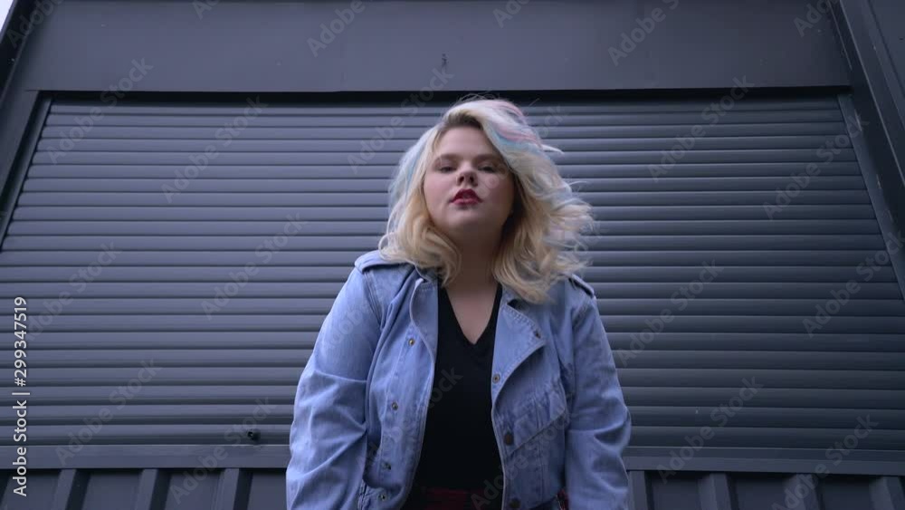 Provocative stylish plus size girl posing, breaking body image stereotypes