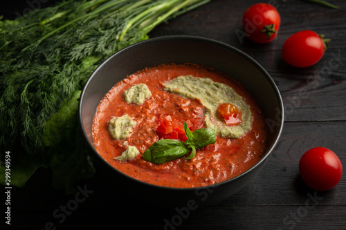tomato cream soup in a black plate