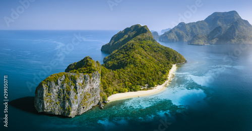 Drone Aerial Panorama image of Helicopter Island in the Bacuit Bay in El Nido  Palawan  Philippines lit by morning sunrise light