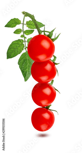 Cherry tomato with leaf isolated on white background with clipping path
