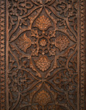 Beautiful ancient dark wood carving detail, carved in a traditional uzbek style, Uzbekistan carving wood, intricate carving with Uzbek motifs, complex wood carving, top view, vertical image