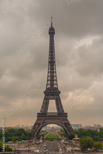 Perfect portrait view of the famous iconic Eiffel Tower from the Chaillot hill on a cloudy hazy summer morning in Paris. The Eiffel Tower is the most-visited paid monument in the world. © H-AB Photography