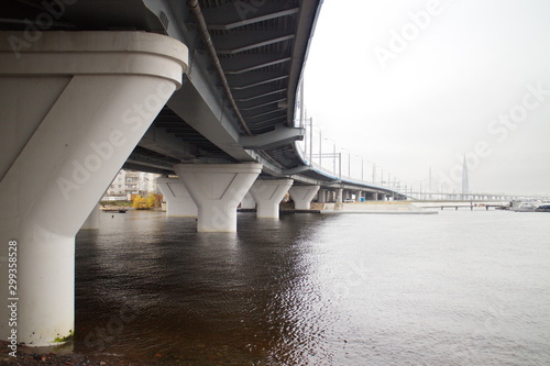 large transport overpass by the river on a cloudy day